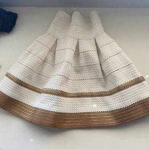 gold and white stiff skirt